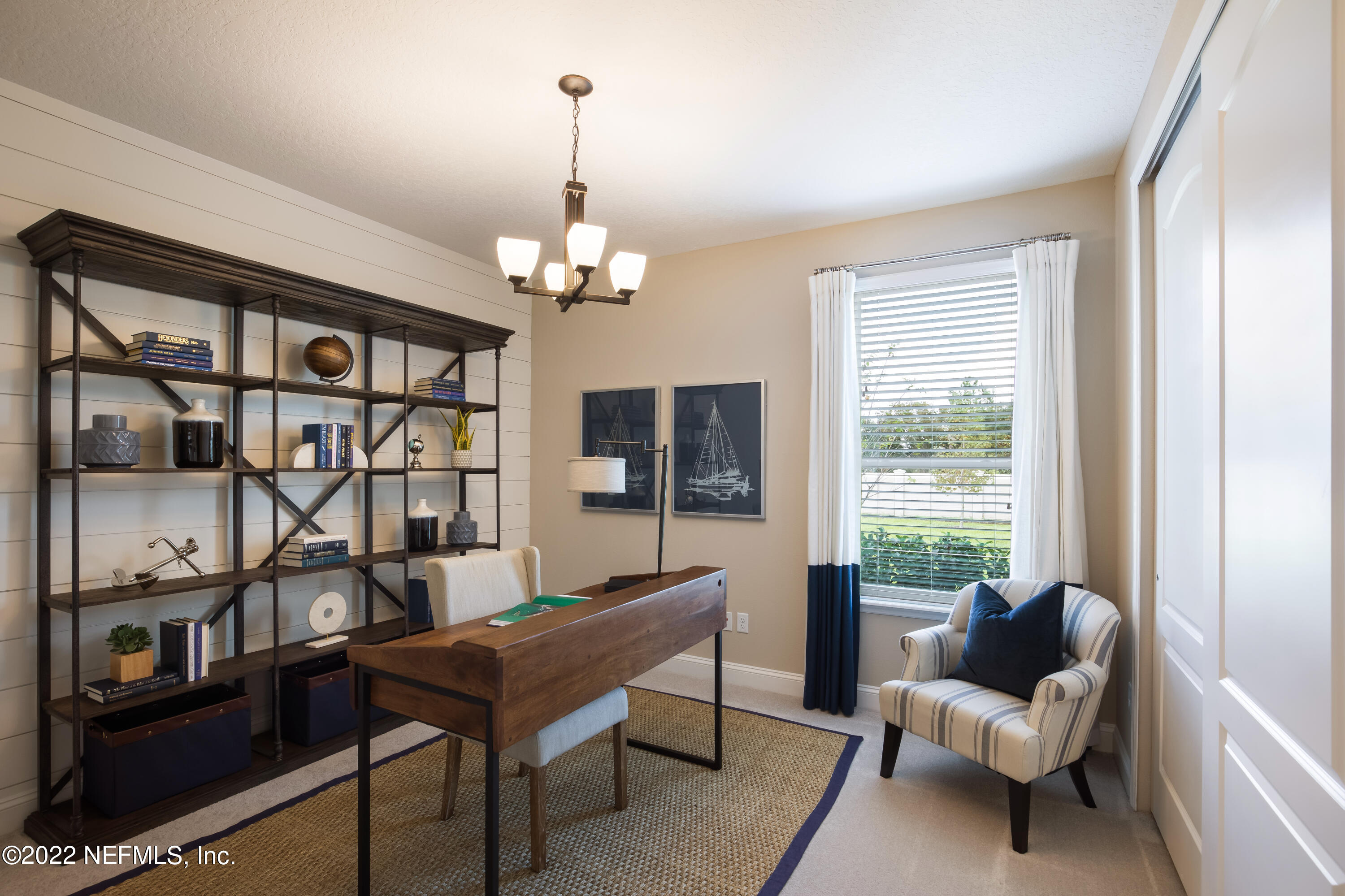 364 Clearview Drive St. Augustine, FL 32092 - Photo 5 of 10 a living room with furniture a rug and a window