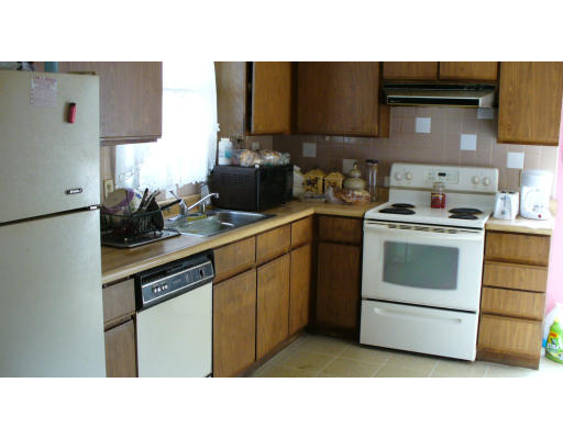 98 River Road Ware, MA 01082 - Photo 2 of 5 a kitchen with stainless steel appliances a stove sink and cabinets