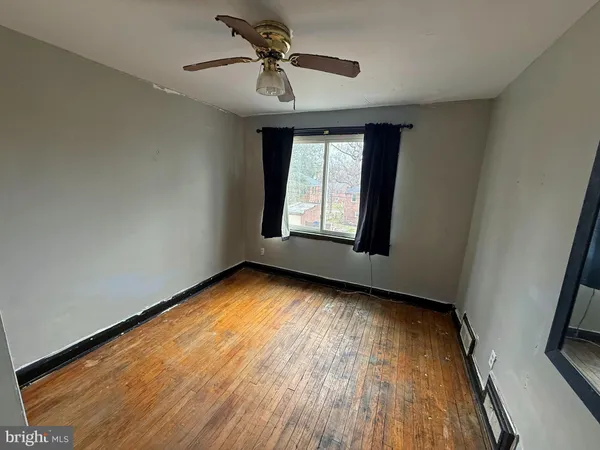 a view of an empty room and window