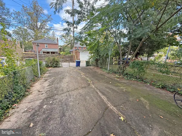 a pathway of a house with a yard