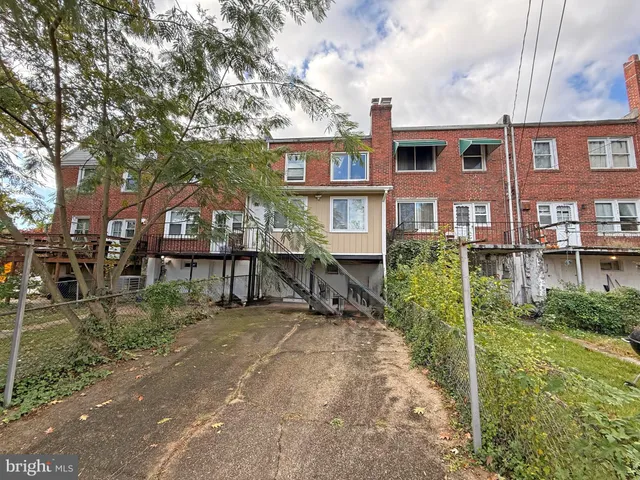 a view of multiple house with a yard