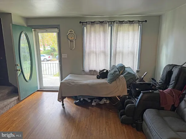 a bed room with a bed and a chair