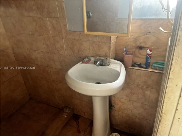 a view of room with wooden floor