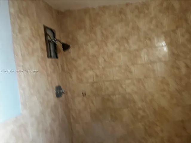 a bedroom with a bed and a mirror