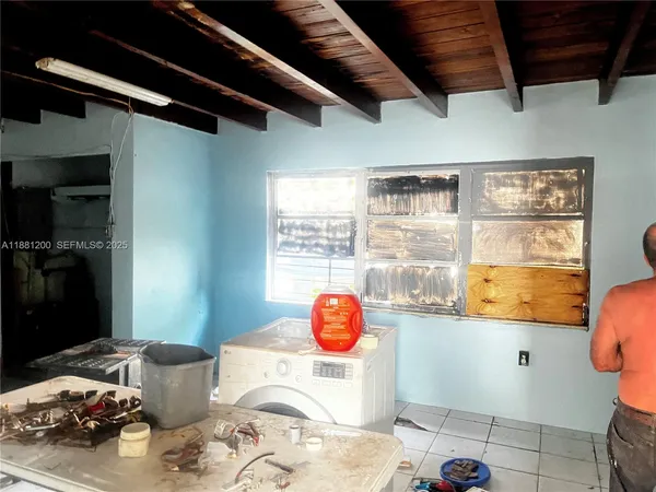 a bedroom with a bed and a mirror