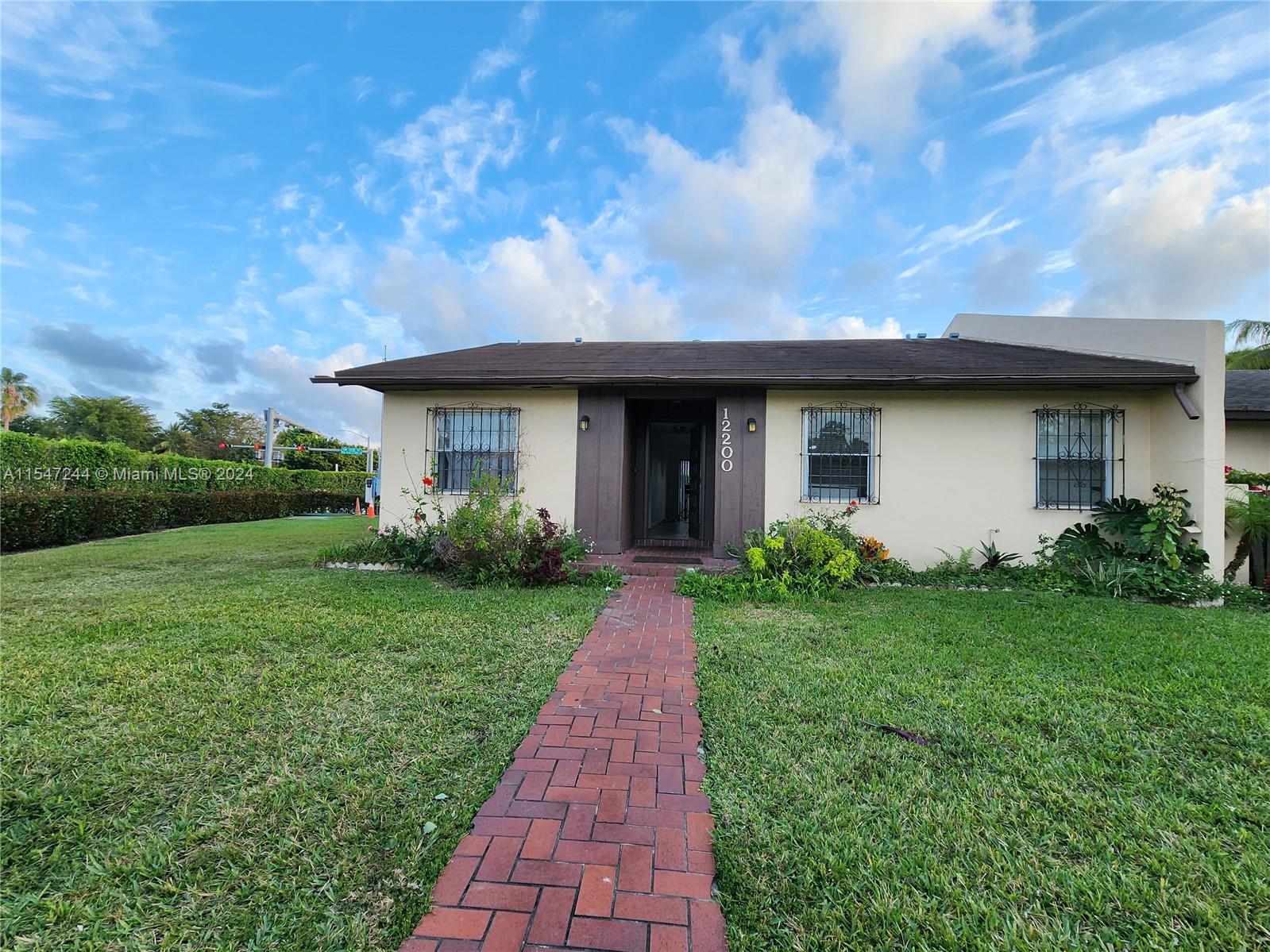 The Crossings Miami, FL 33186 - Photo 16 of 19 a view of a house with yard and a garden