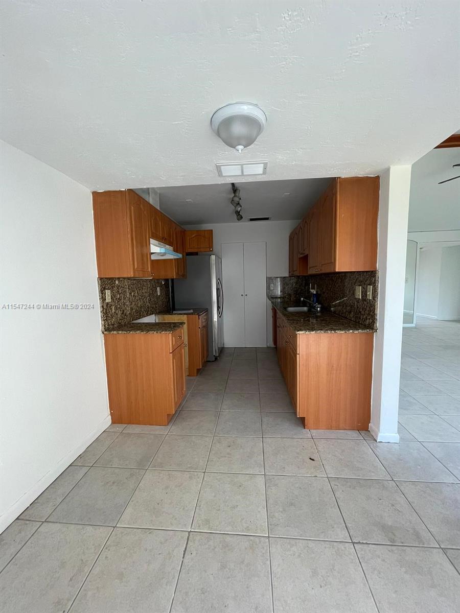 The Crossings Miami, FL 33186 - Photo 17 of 19 a kitchen with granite countertop a cabinets and steel stainless steel appliances