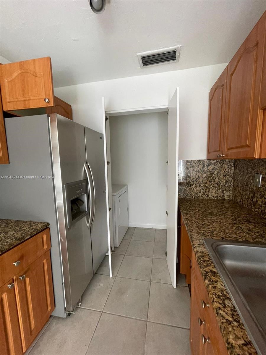 The Crossings Miami, FL 33186 - Photo 19 of 19 a kitchen with a refrigerator and a sink