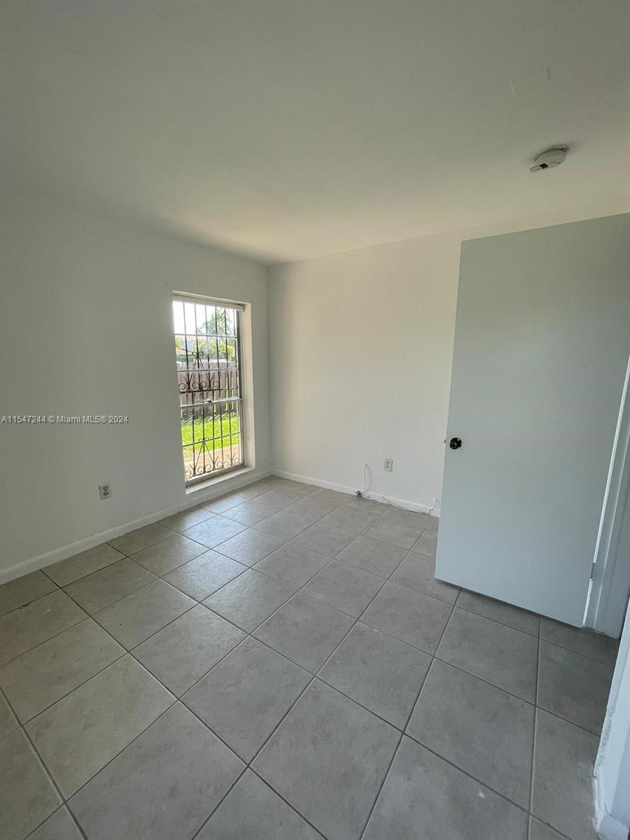 The Crossings Miami, FL 33186 - Photo 8 of 19 a view of an empty room with a window