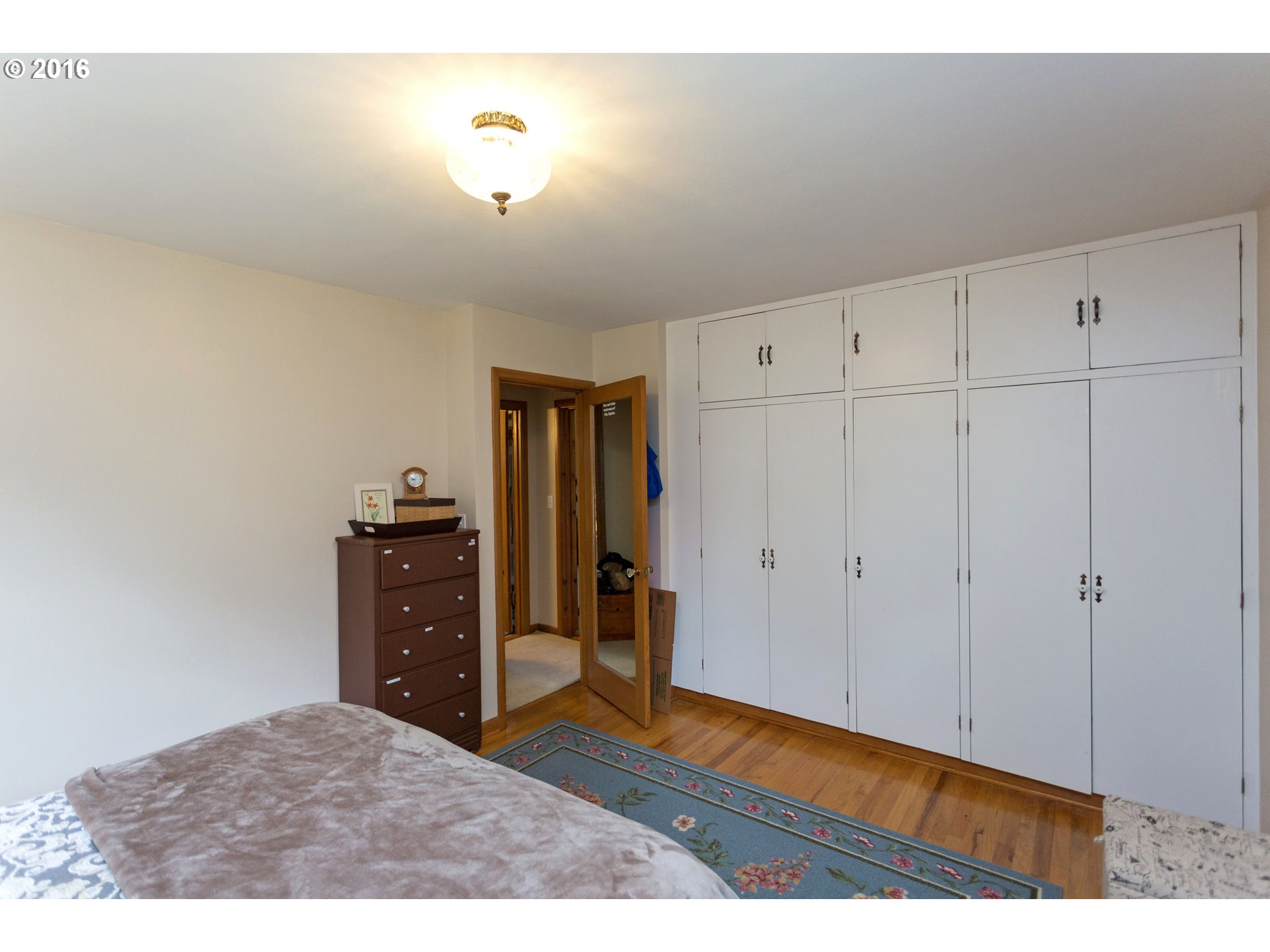 8770 Southwest Garden Home Road Portland, OR 97223 - Photo 14 of 30 a room with closet and wooden floor