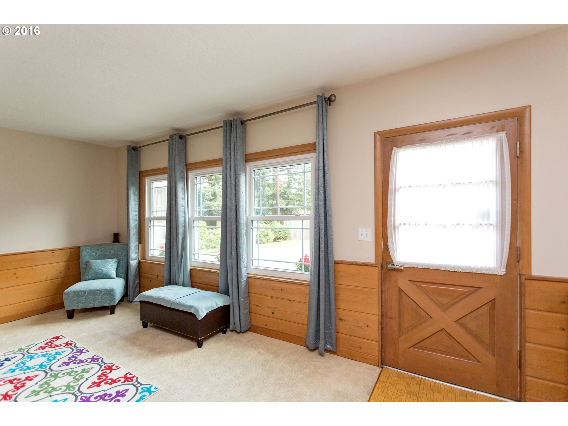 8770 Southwest Garden Home Road Portland, OR 97223 - Photo 17 of 30 a bedroom with furniture and a window