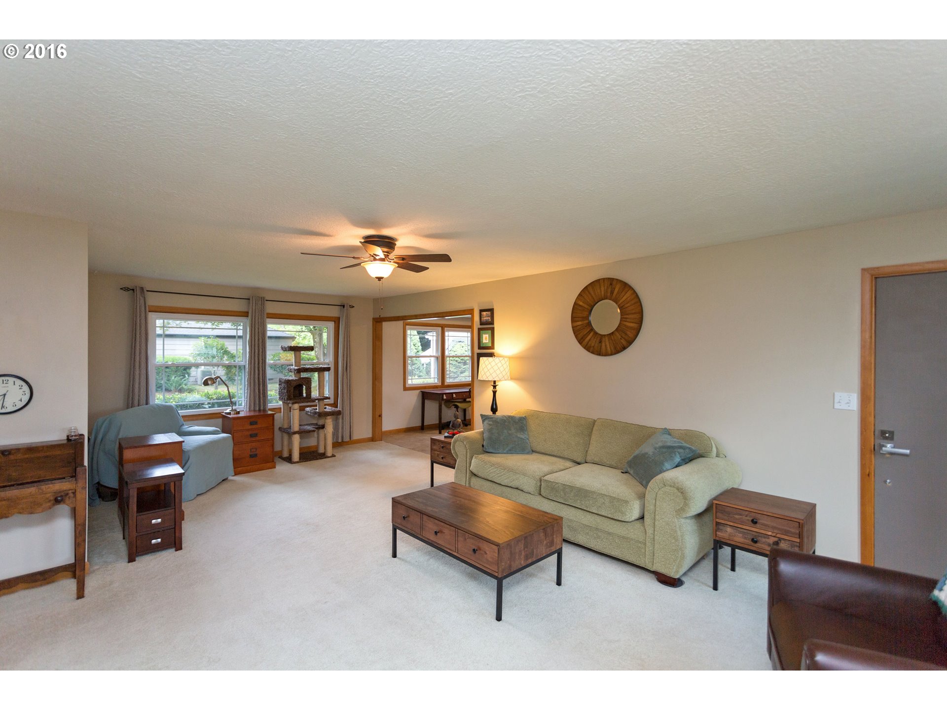 8770 Southwest Garden Home Road Portland, OR 97223 - Photo 7 of 30 a living room with furniture a table and a large window