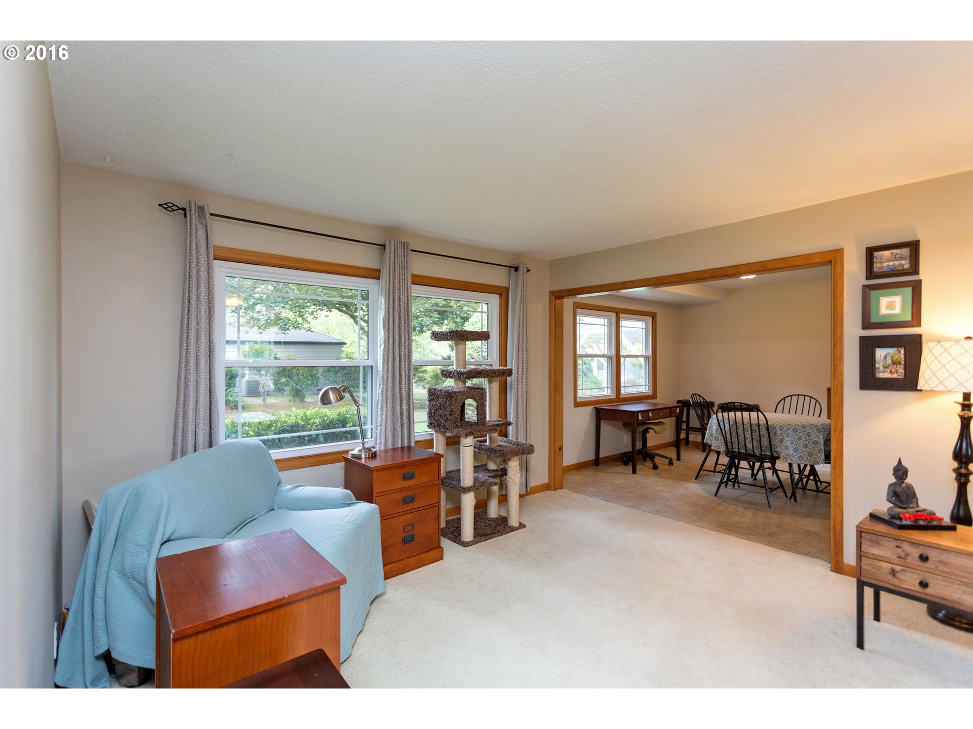 8770 Southwest Garden Home Road Portland, OR 97223 - Photo 9 of 30 a living room with furniture and a large window