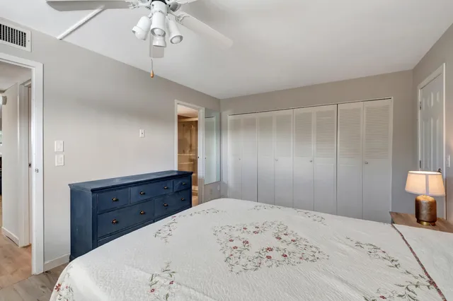 a bedroom with a bed and a dresser