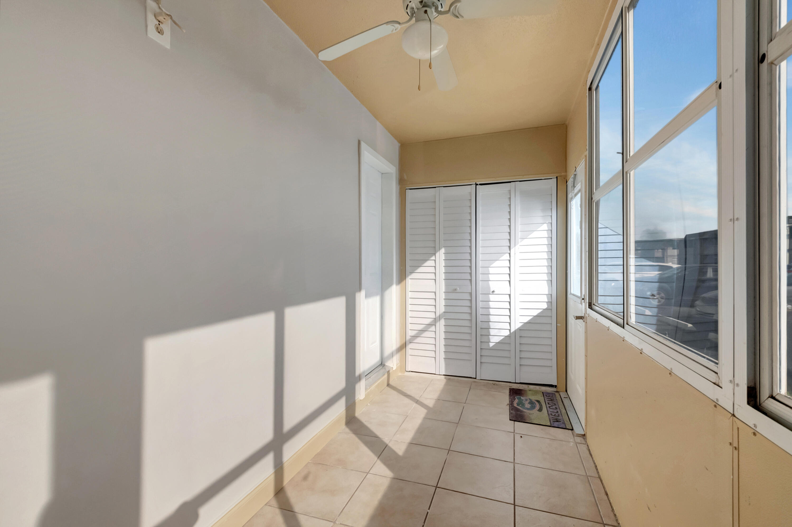 195 Monaco Way, Unit 195 Delray Beach, FL 33446 - Photo 23 of 64 a view of an entryway with a window