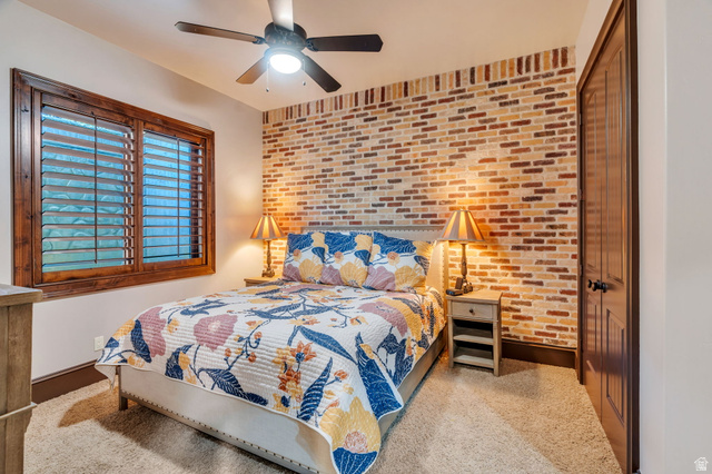 811 South High Ridge Drive Alpine, UT 84004 - Photo 56 of 98 Bedroom featuring brick wall, a ceiling fan, and an accent wall