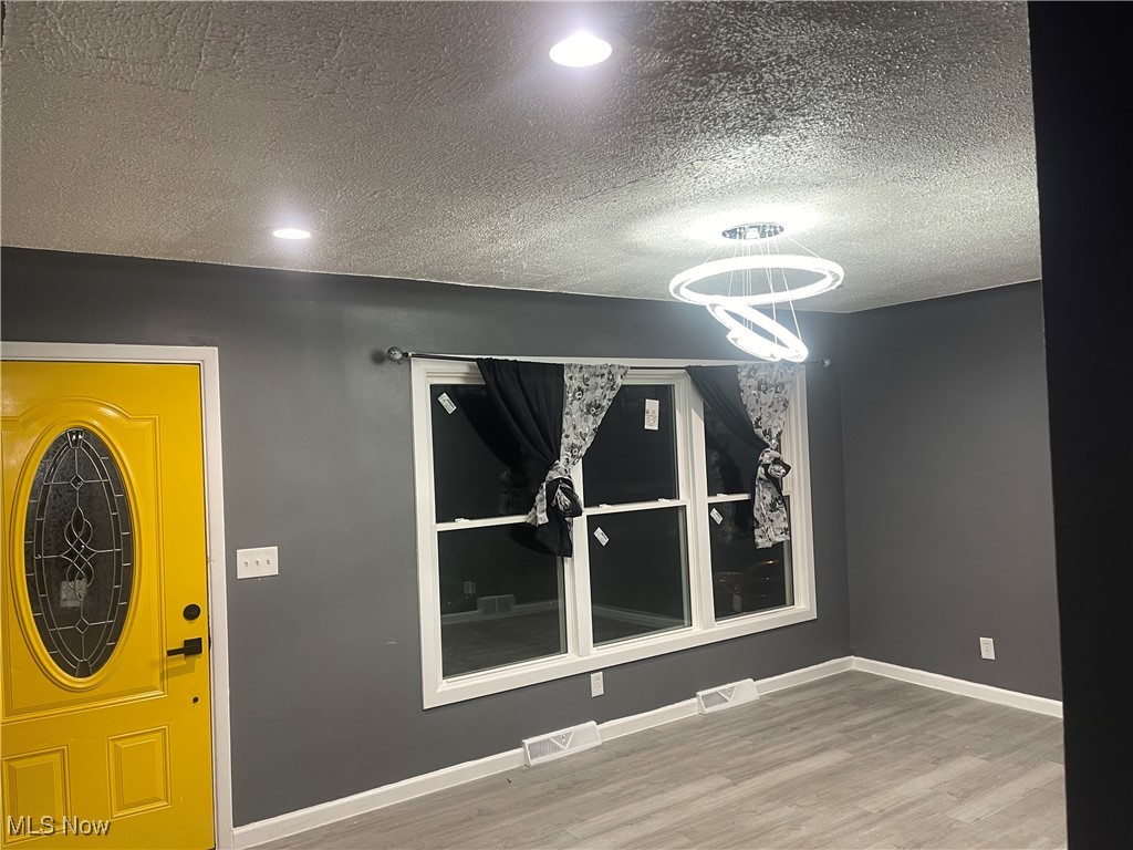603 Liberty Road Youngstown, OH 44505 - Photo 21 of 42 Entryway featuring a textured ceiling and light wood-type flooring