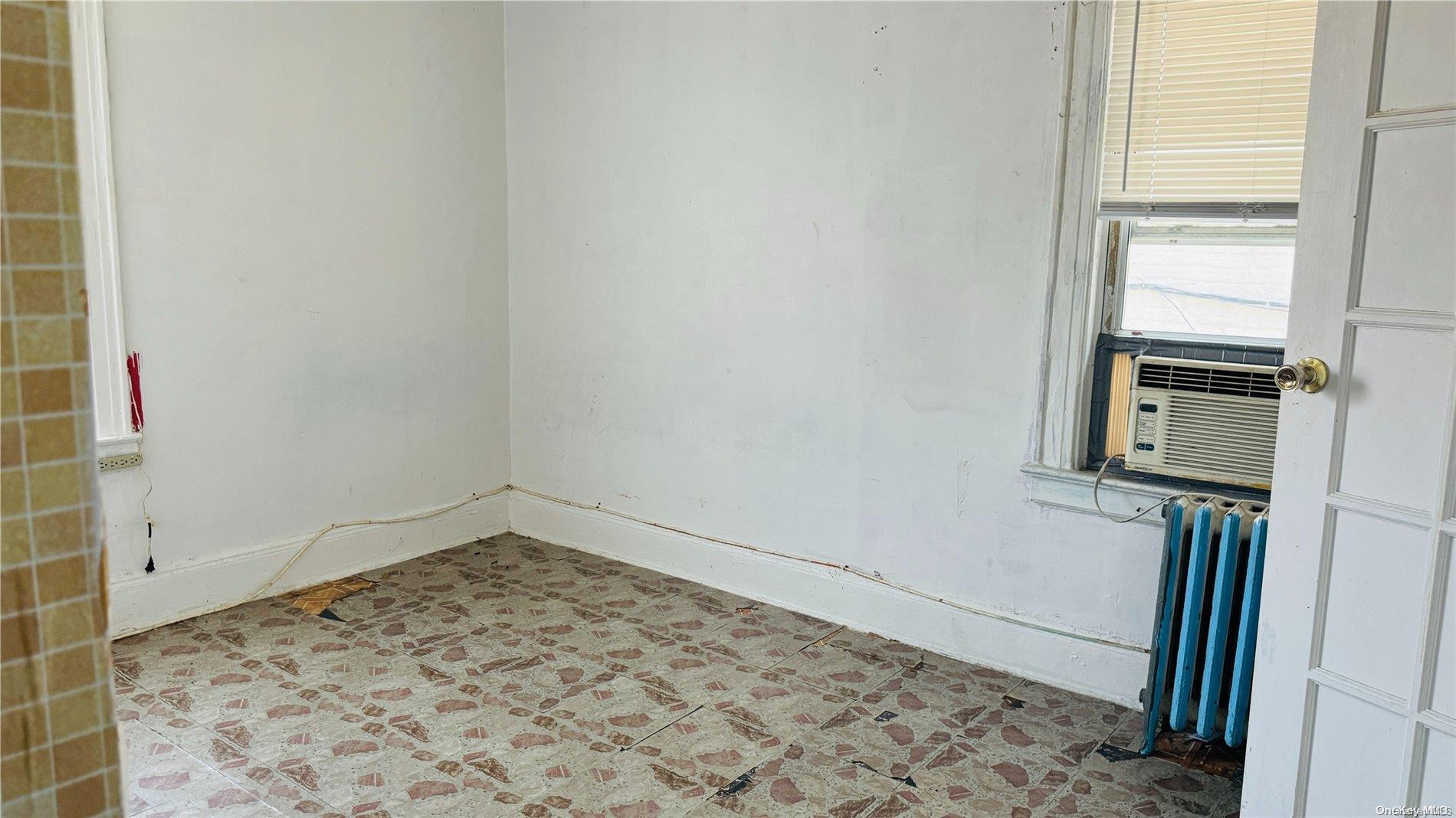 37-33 97th Street Queens, NY 11368 - Photo 5 of 14 a view of a room with window