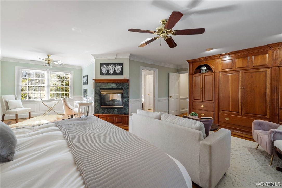 2201 Mt Blanco Road Chester, VA 23836 - Photo 18 of 49 a large bedroom with a large bed a flat screen tv and couches