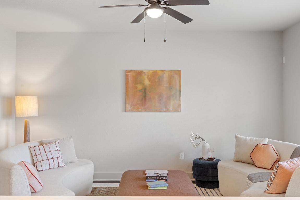 2056 Local Rebel Street Leander, TX 78641 - Photo 11 of 39 a living room with furniture and a lamp