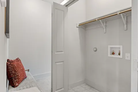 a bathroom with a shower and a mirror
