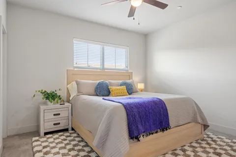 a bedroom with a bed and a walk in closet