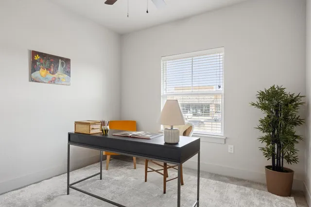 a workspace with furniture and window