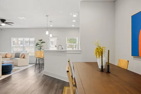 a view of a living room and dining room