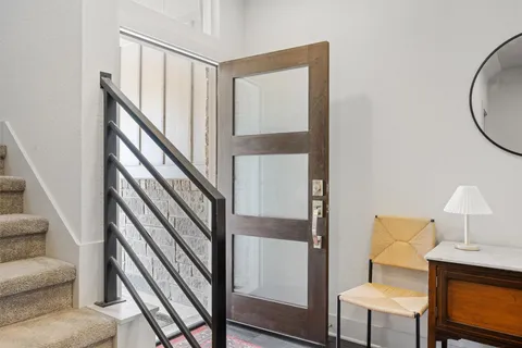 a bathroom with a toilet a sink and a mirror