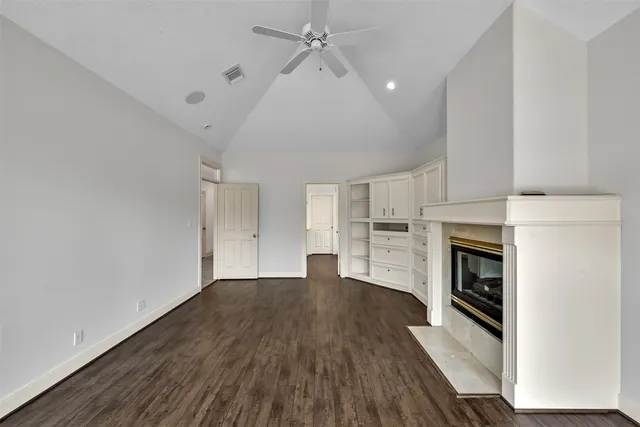 a bathroom with a glass shower door and a window