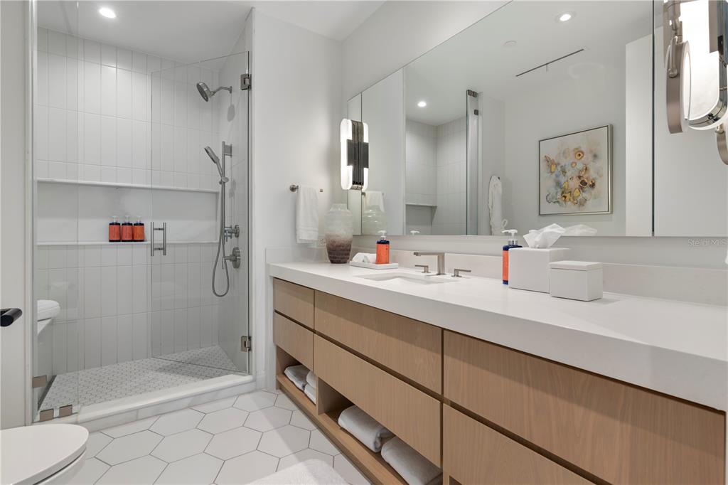 10160 Autumn Mist Lane, Unit 302 Orlando, FL 32836 - Photo 16 of 46 a bathroom with a sink mirror vanity and toilet