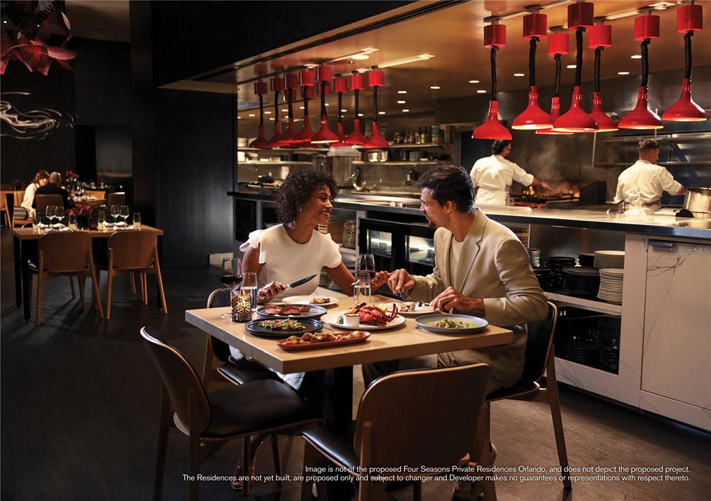 10160 Autumn Mist Lane, Unit 302 Orlando, FL 32836 - Photo 35 of 46 a table and chairs in front of a store