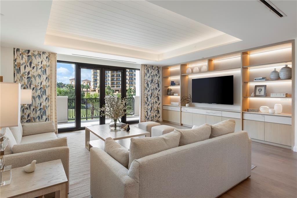 10160 Autumn Mist Lane, Unit 302 Orlando, FL 32836 - Photo 5 of 46 a living room with furniture and a flat screen tv