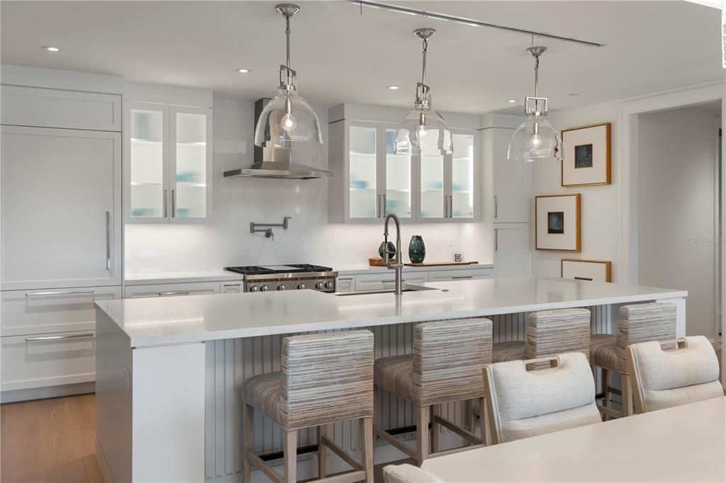 10160 Autumn Mist Lane, Unit 302 Orlando, FL 32836 - Photo 9 of 46 a kitchen with stainless steel appliances granite countertop a sink a stove and a refrigerator