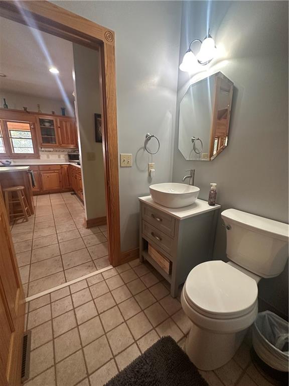 8275 Pea Ridge Road Cornelia, GA 30531 - Photo 14 of 52 a bathroom with a toilet sink and mirror