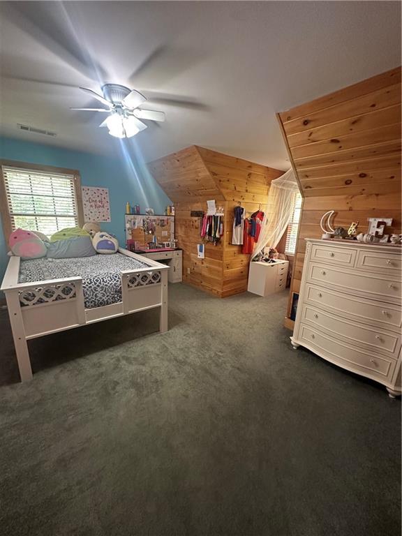 8275 Pea Ridge Road Cornelia, GA 30531 - Photo 19 of 52 a spacious bedroom with a bed and a walk in closet