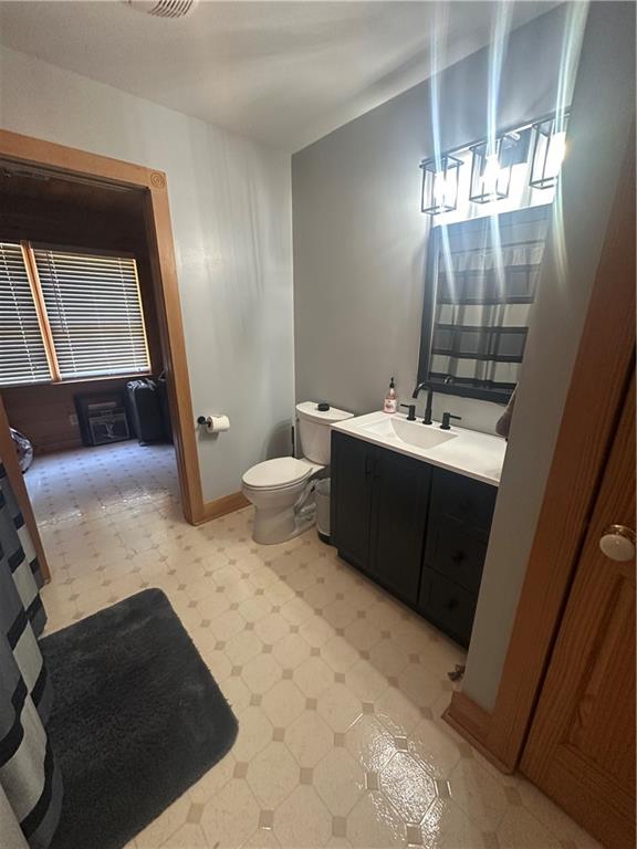 8275 Pea Ridge Road Cornelia, GA 30531 - Photo 21 of 52 a bathroom with a sink toilet and mirror