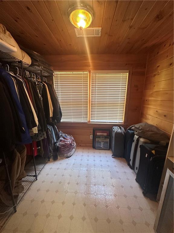 8275 Pea Ridge Road Cornelia, GA 30531 - Photo 23 of 52 a view of walk in closet with clothes and shoes