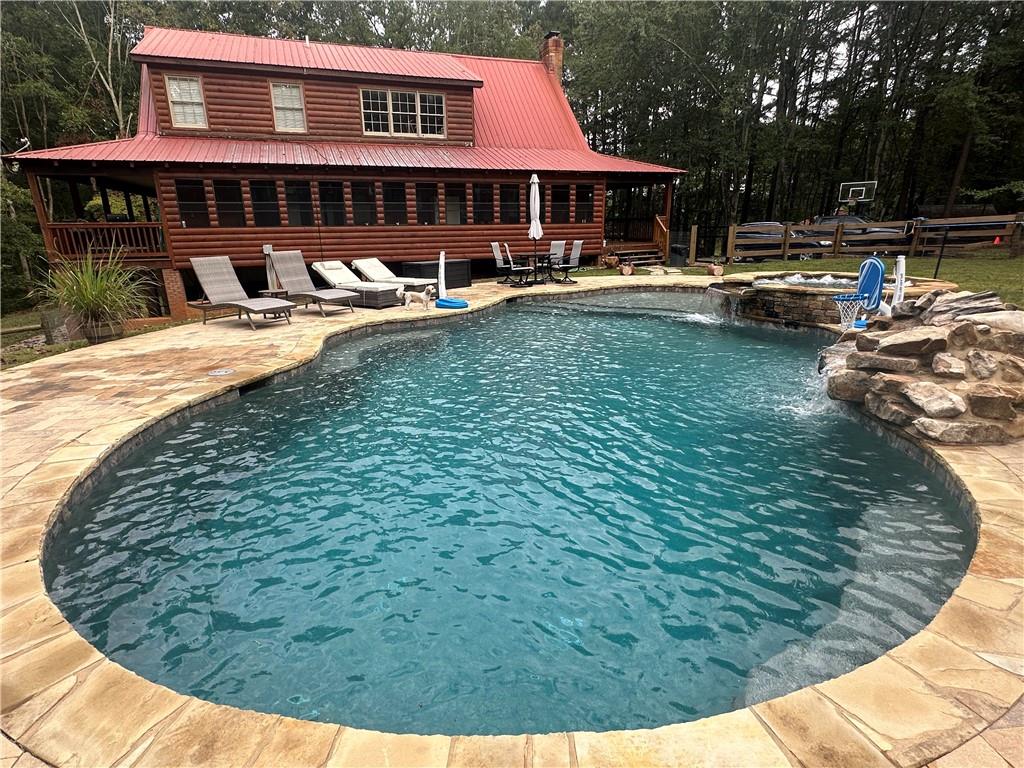 8275 Pea Ridge Road Cornelia, GA 30531 - Photo 3 of 52 a view of a house with swimming pool and sitting area