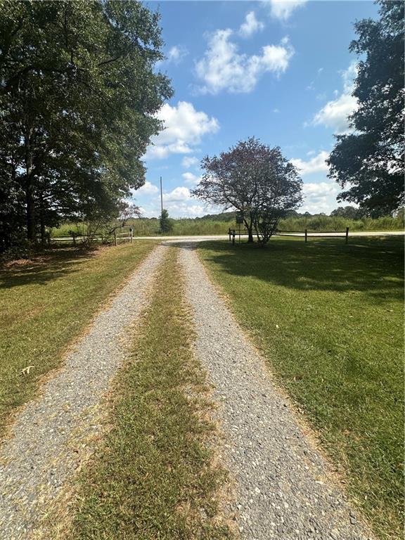 8275 Pea Ridge Road Cornelia, GA 30531 - Photo 42 of 52 a view of a lake with houses in the background