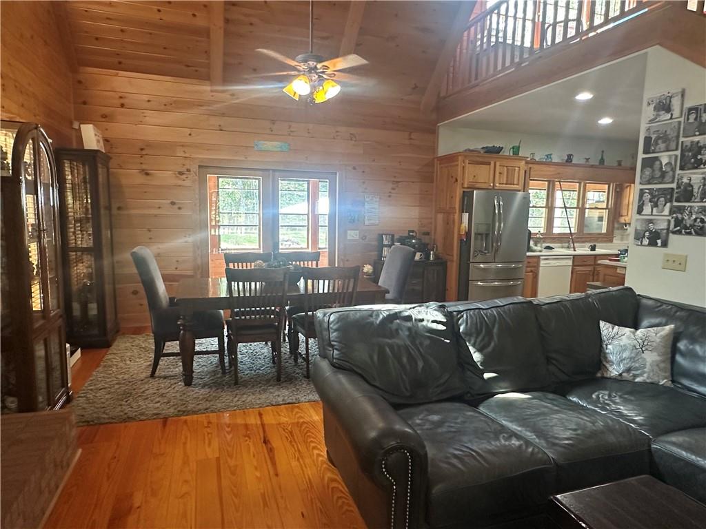 8275 Pea Ridge Road Cornelia, GA 30531 - Photo 10 of 52 a living room with furniture and a chandelier