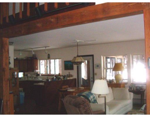 44 Falls Road Sunderland, MA 01375 - Photo 2 of 6 a living room with furniture and a chandelier