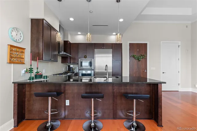 a kitchen with kitchen island granite countertop wooden cabinets and counter space