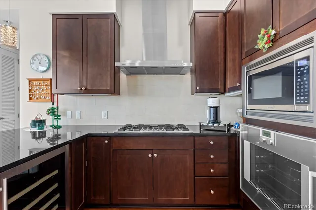 a kitchen with granite countertop cabinets and window