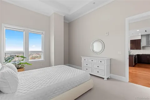 a bedroom with a bed and a dresser