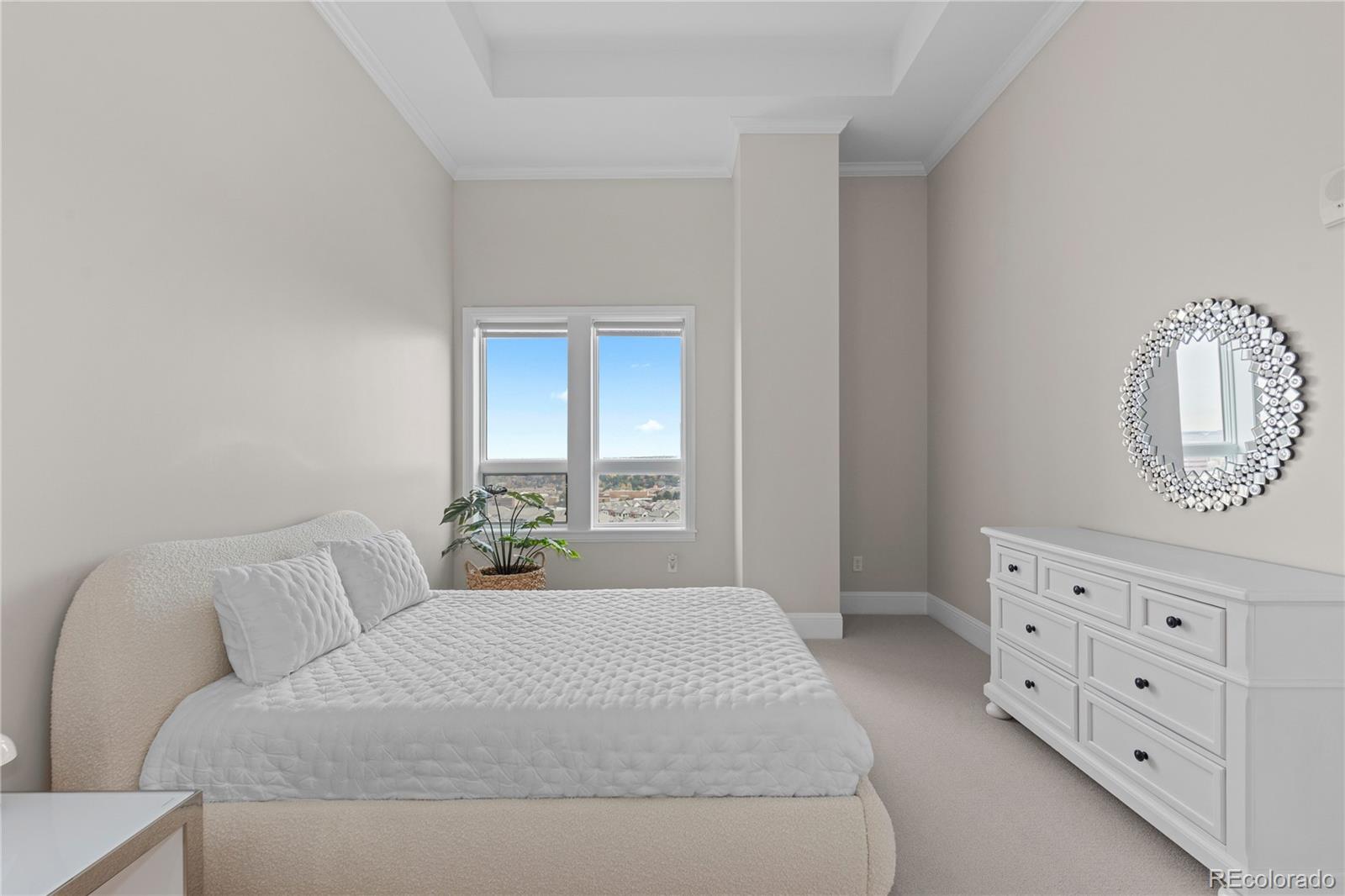 7600 Land Mark Way, Unit 1411 Greenwood Village, CO 80111 - Photo 25 of 50 a bedroom with a bed and a dresser