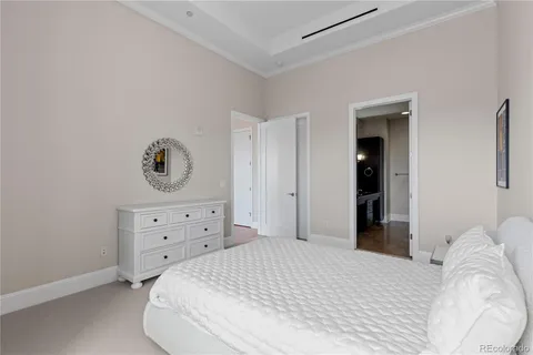 a bedroom with a bed and cabinets