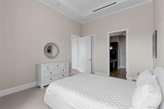 a bedroom with a bed and cabinets