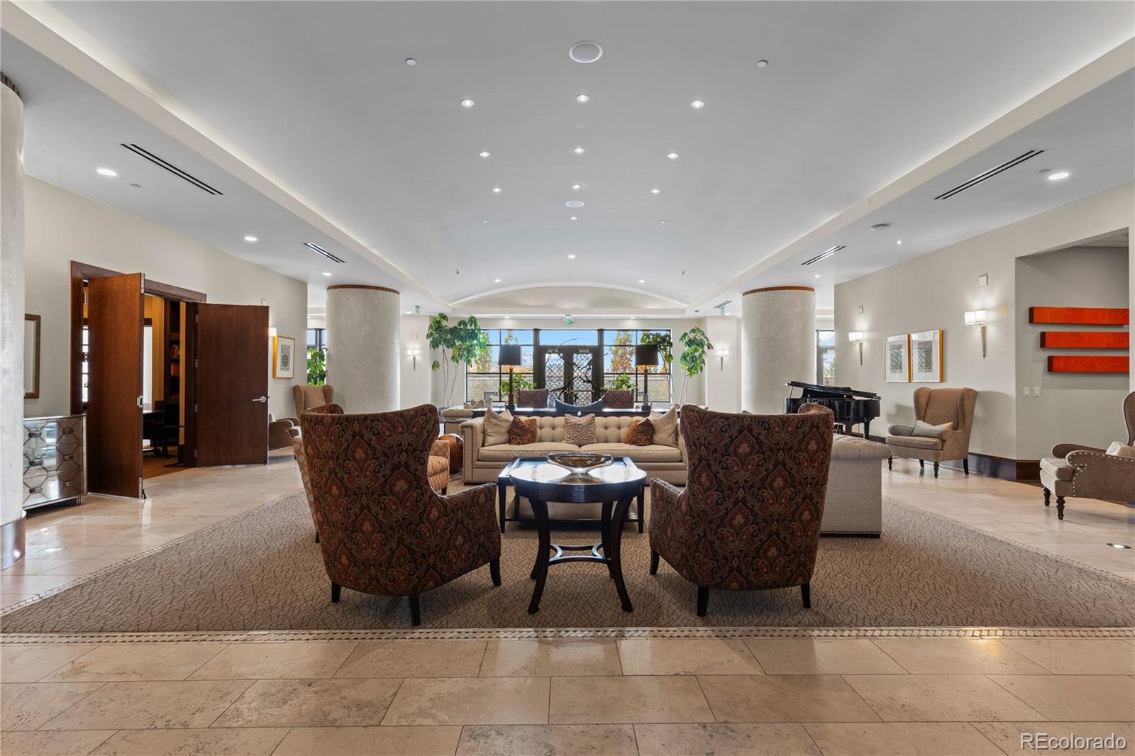 7600 Land Mark Way, Unit 1411 Greenwood Village, CO 80111 - Photo 42 of 50 a living room with furniture and a dining table with kitchen view