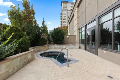 a view of a swimming pool with a lounge chair